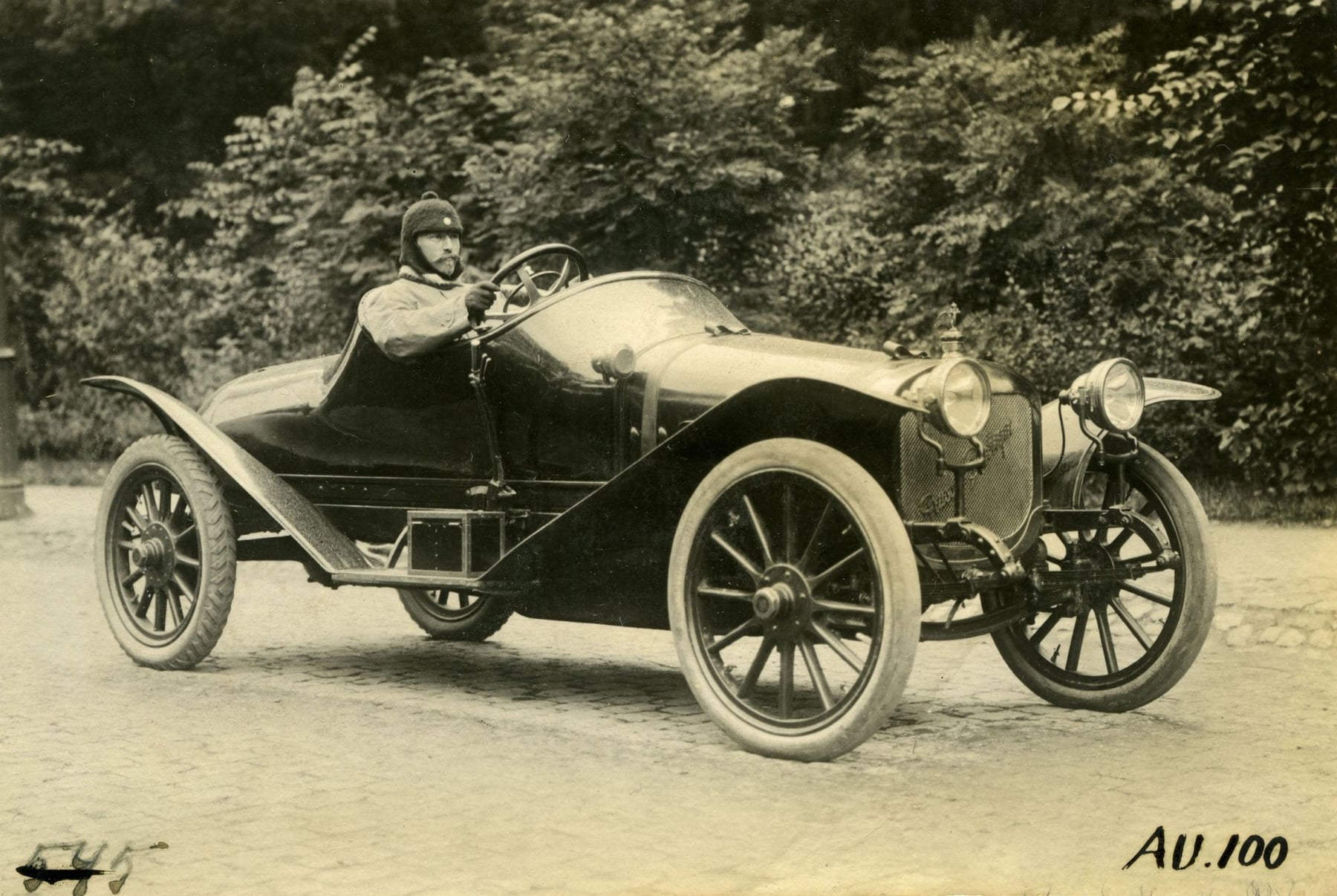 An early Russo-Balt two-seater with its driver, archive photograph