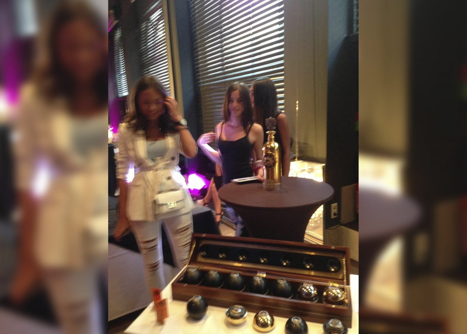 Guests around the gold DARTZ RussoBaltique vodka and caviar case at the Cannes Film Festival Auction 2015, Hôtel Barrière Le Majestic