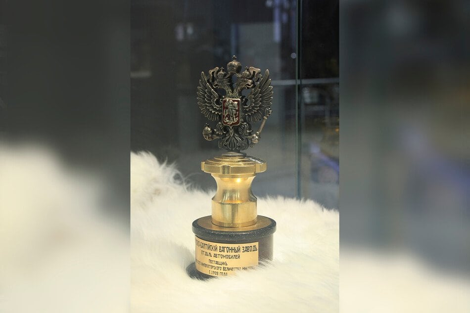 Gold trophy crowned with a double-headed eagle, on display