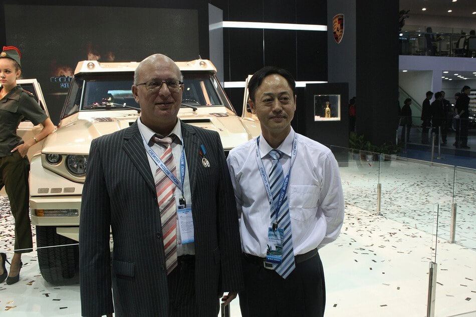 DARTZ representatives beside the Prombron’ on the motor-show stand