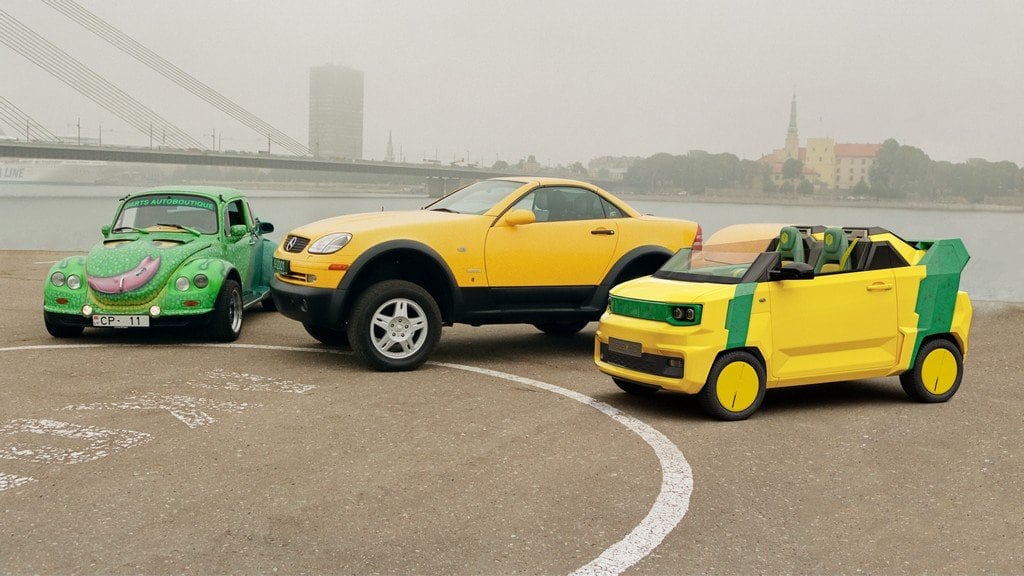 Three FreZe EV roadsters by the Vanšu Bridge on the Daugava embankment in Riga
