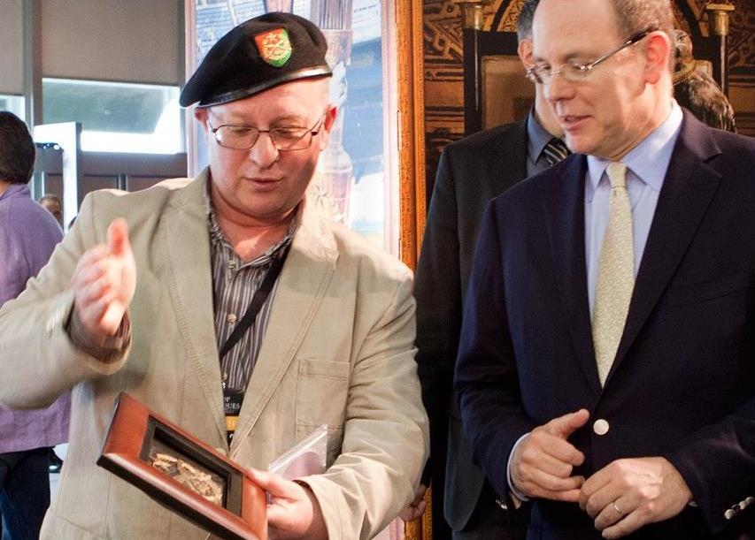 Leonard F. Yankelovich presenting a framed DARTZ award to Prince Albert II of Monaco