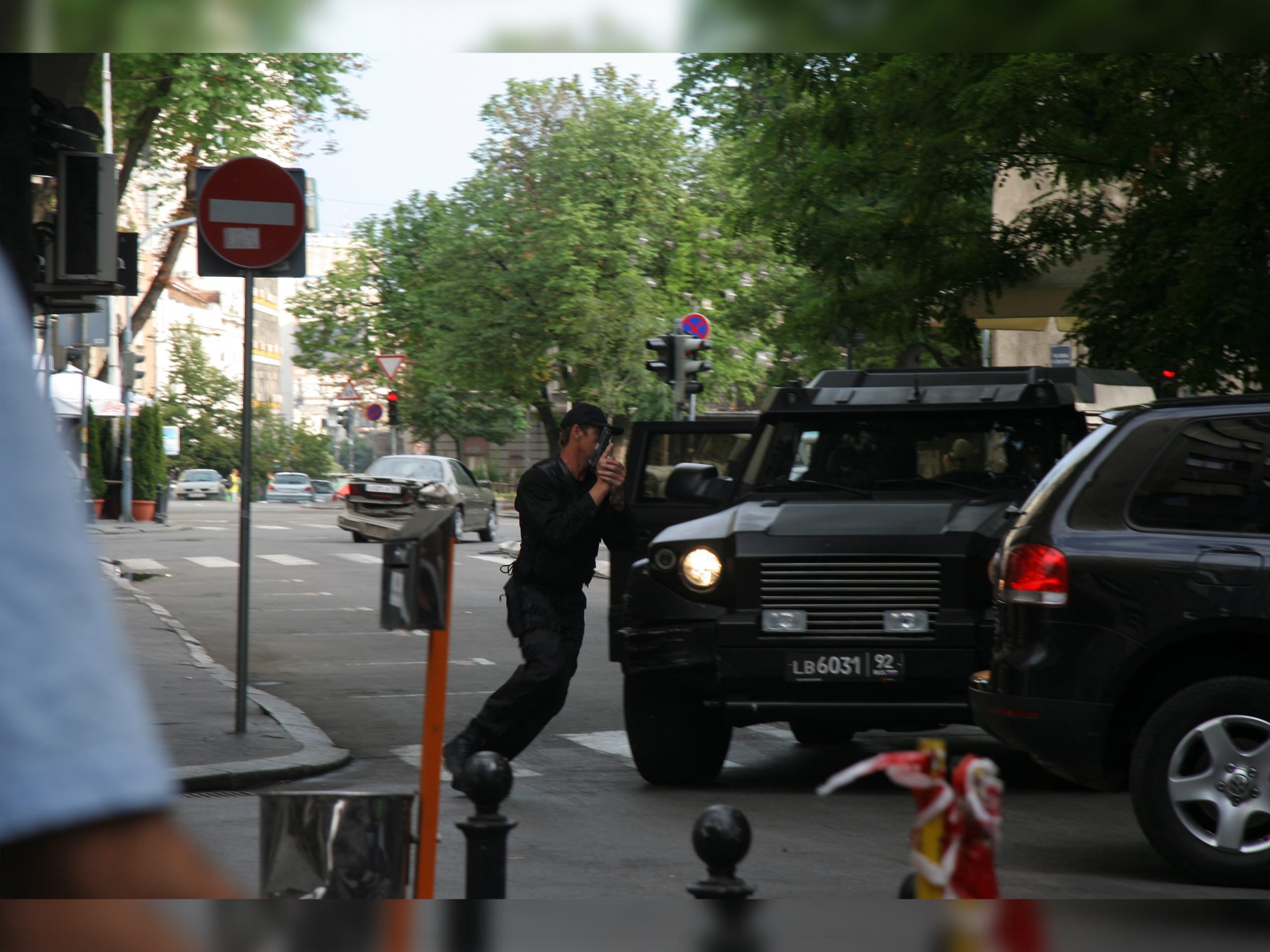 Black DARTZ Prombron’ on a street film set with a stunt actor