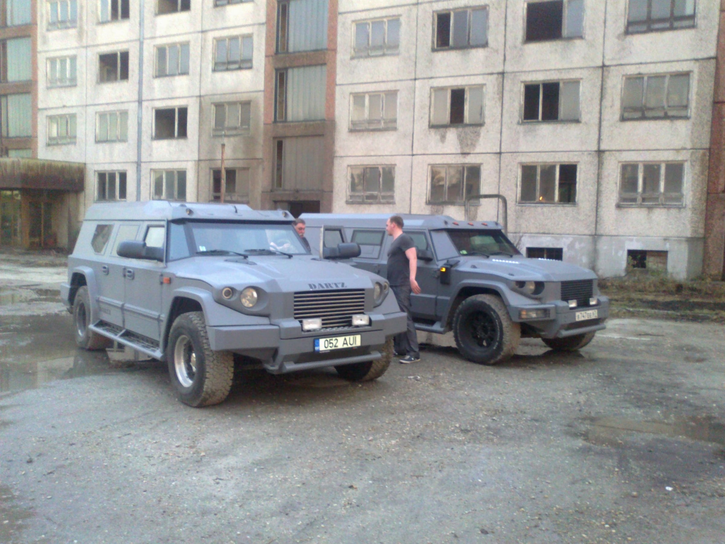 Two grey DARTZ Prombron’ cars by an apartment block on the A Good Day to Die Hard set