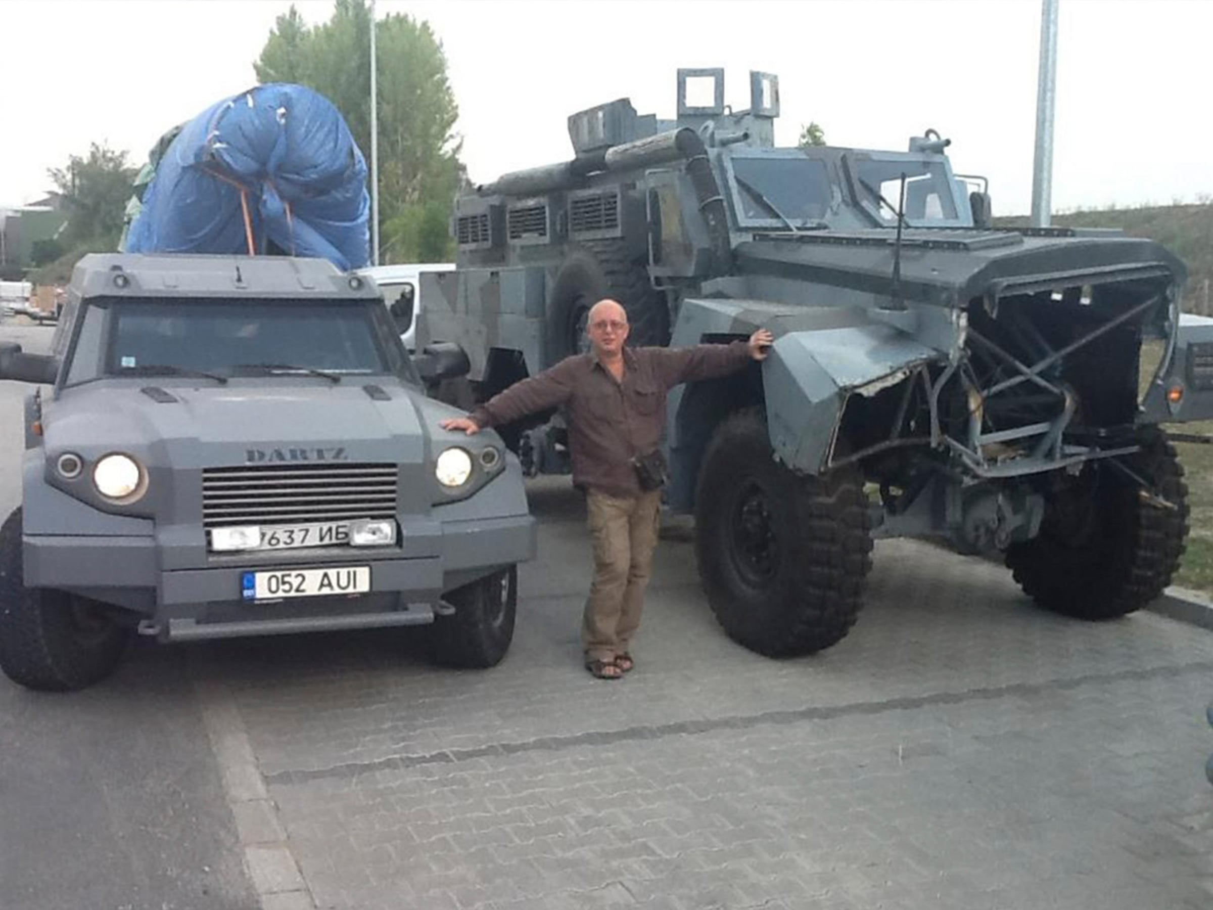 Grey DARTZ Prombron’ and the MRAP stunt truck parked together