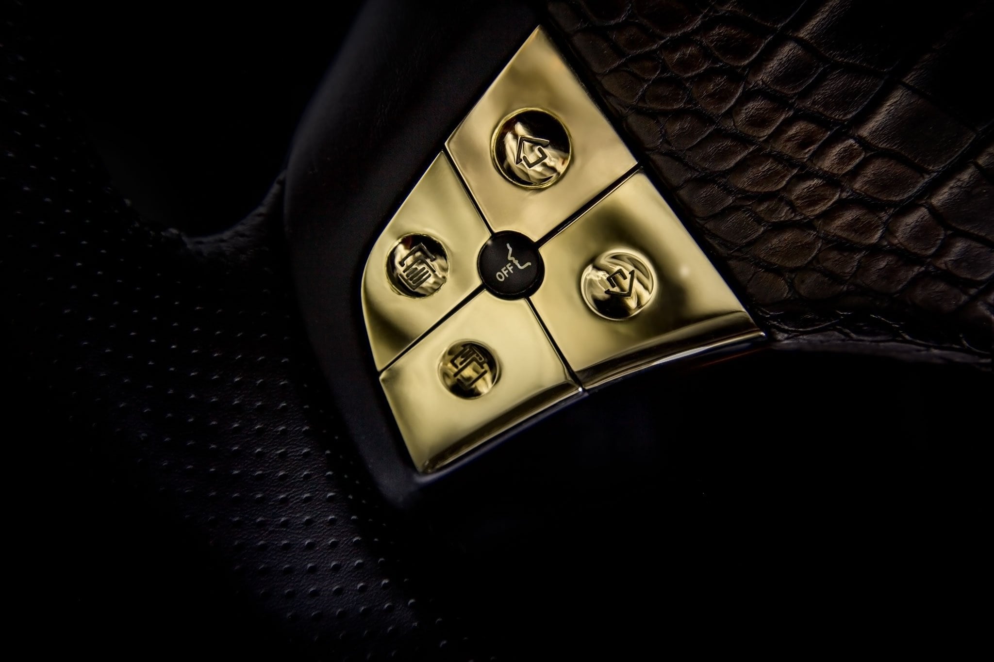Gold DARTZ steering-wheel buttons set in crocodile leather