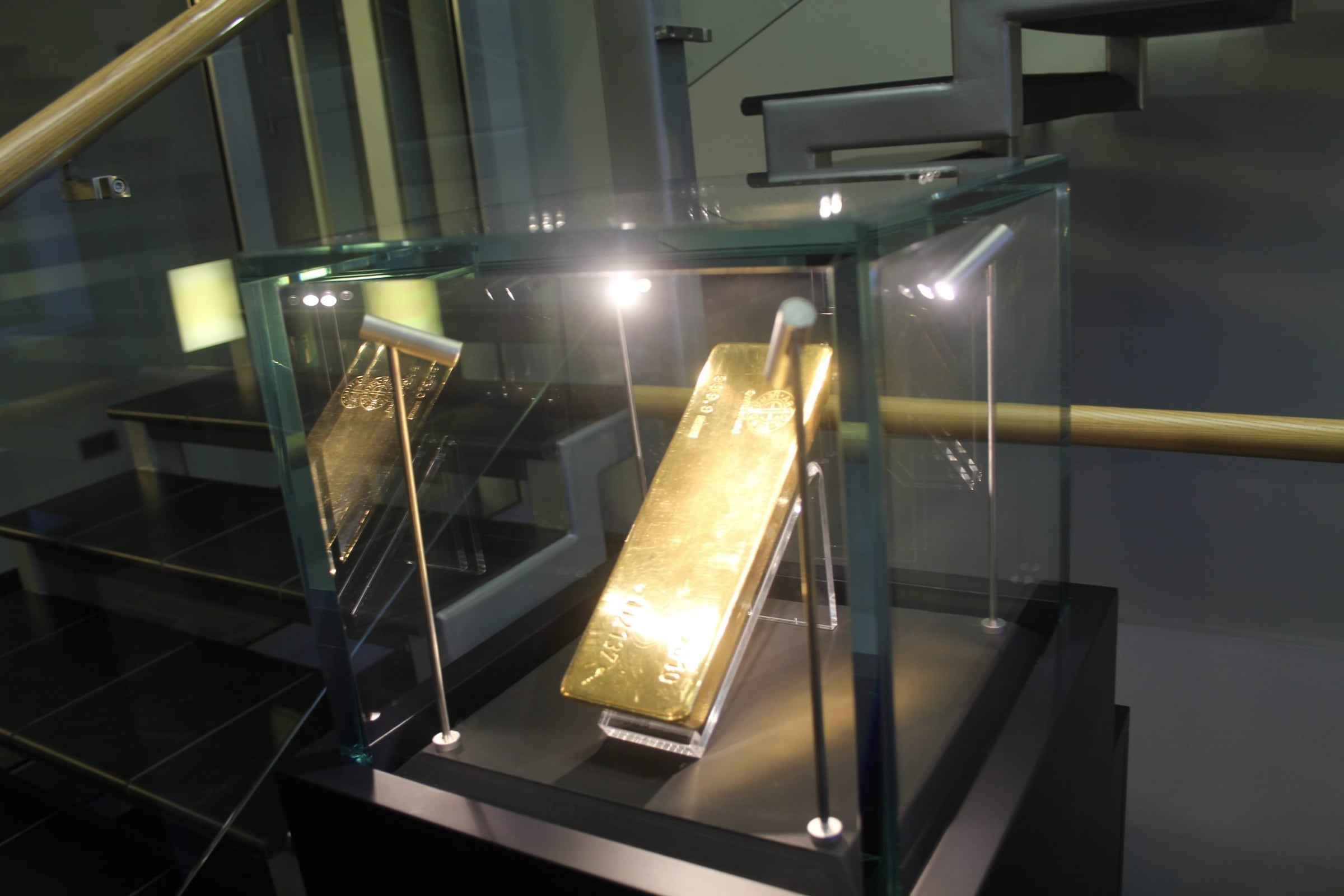 Gold bar displayed in a lit glass vitrine